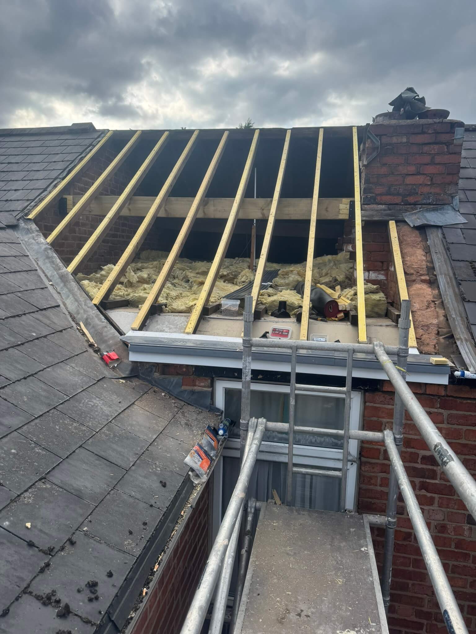New_Roof_Stripped_Rafters_Your_Space_Innovations_Roofing_&_Building_Services_Ltd Exposed roof rafters after the old tiles and battens were removed